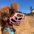 The Muzzle Movement Rex muzzle on a small poodle in pink with pastel pink biothane strapping